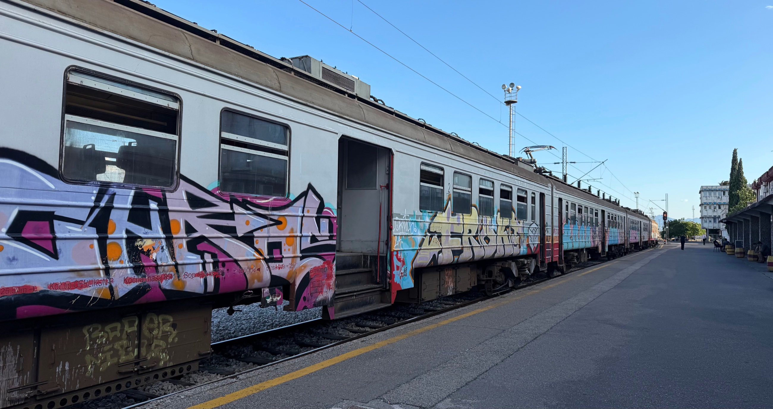 A Yugoslav-era train from Bar to Podgorica, weathered, graffitied, and still connecting the coast to the capital.