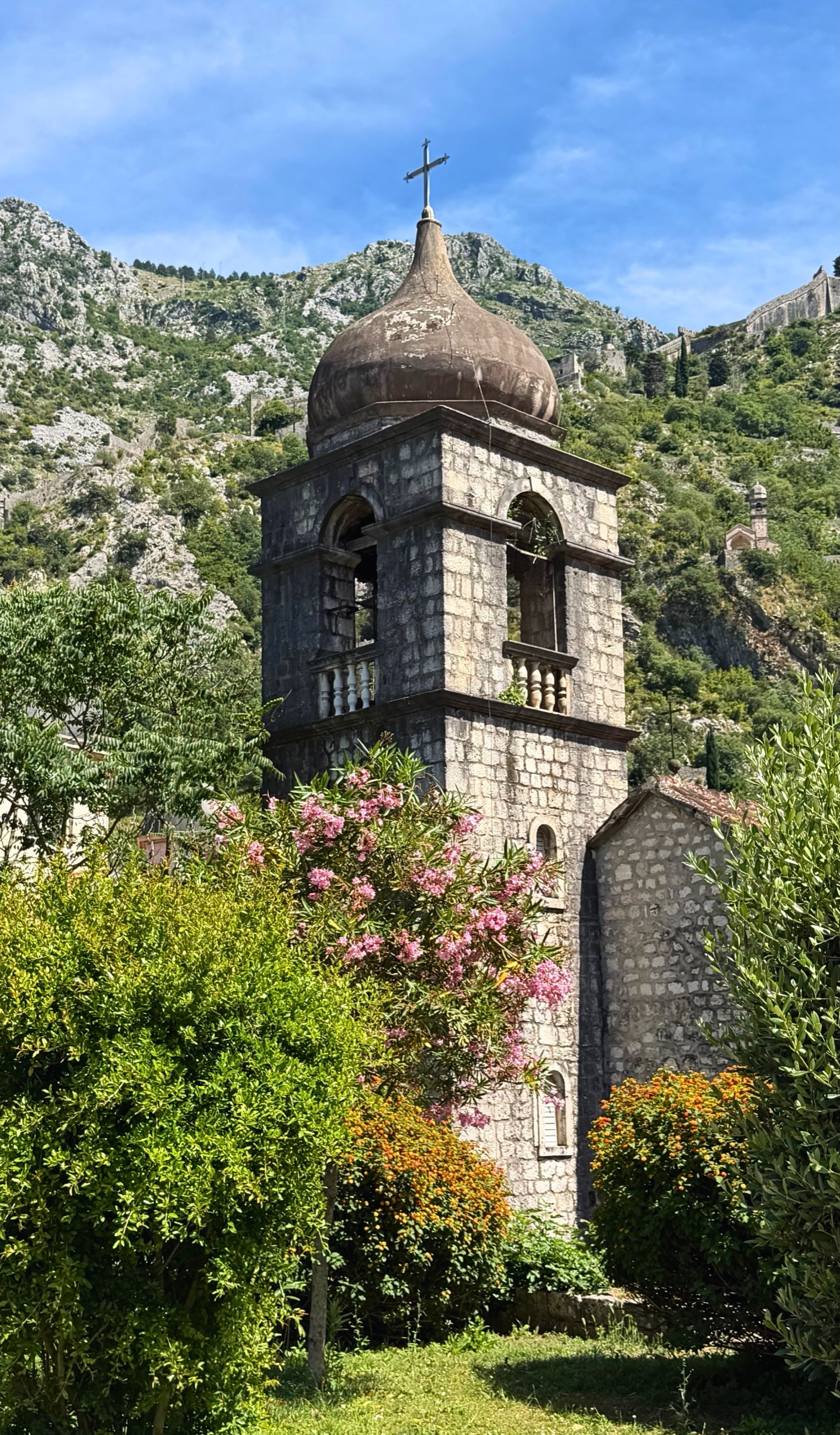 St. Nicholas Church in Kotor Old Town beneath the mountain walls.