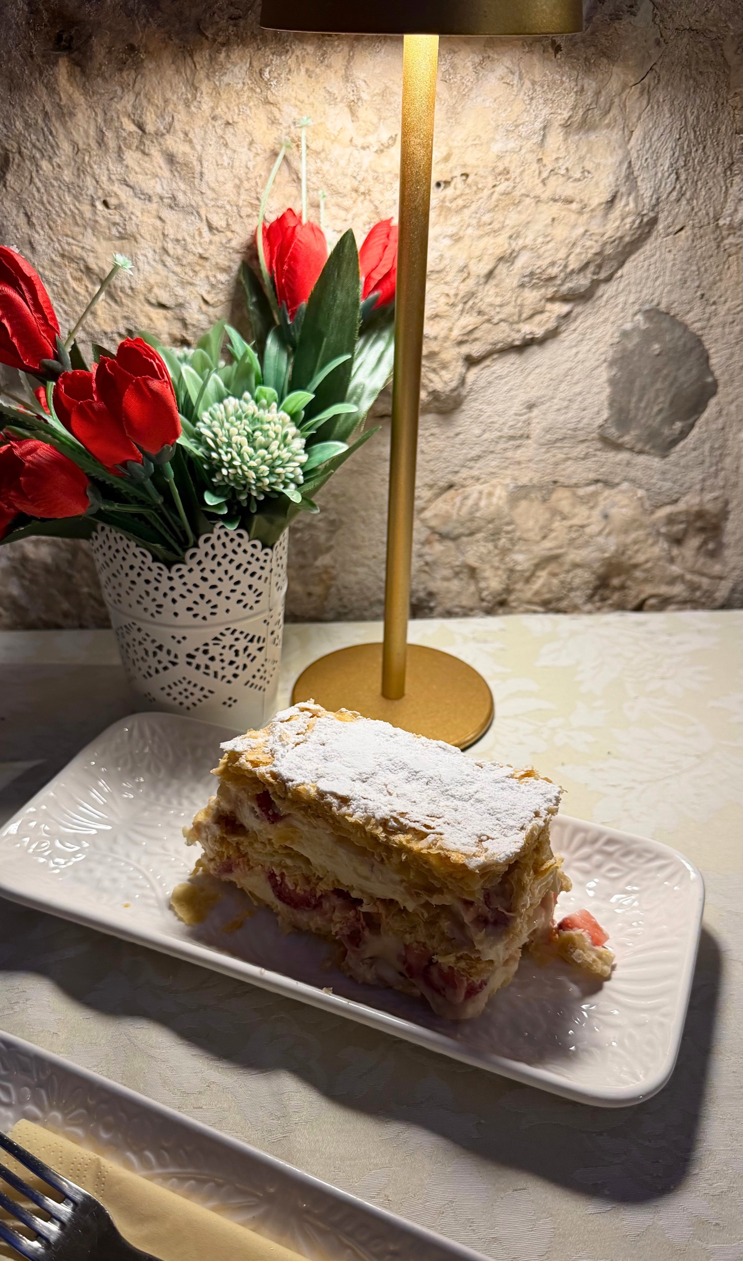 Kotorska krempita at Hotel Montecristo with layered pastry, vanilla cream, and strawberry.