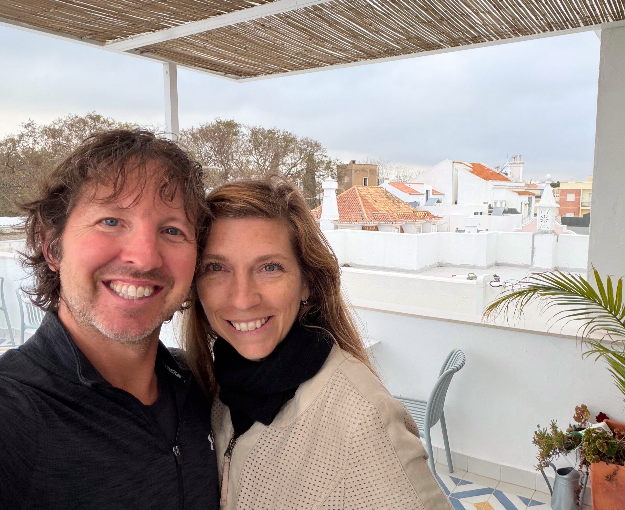Sam and Stephanie on a rooftop porch in Faro before traveling to Lagos.