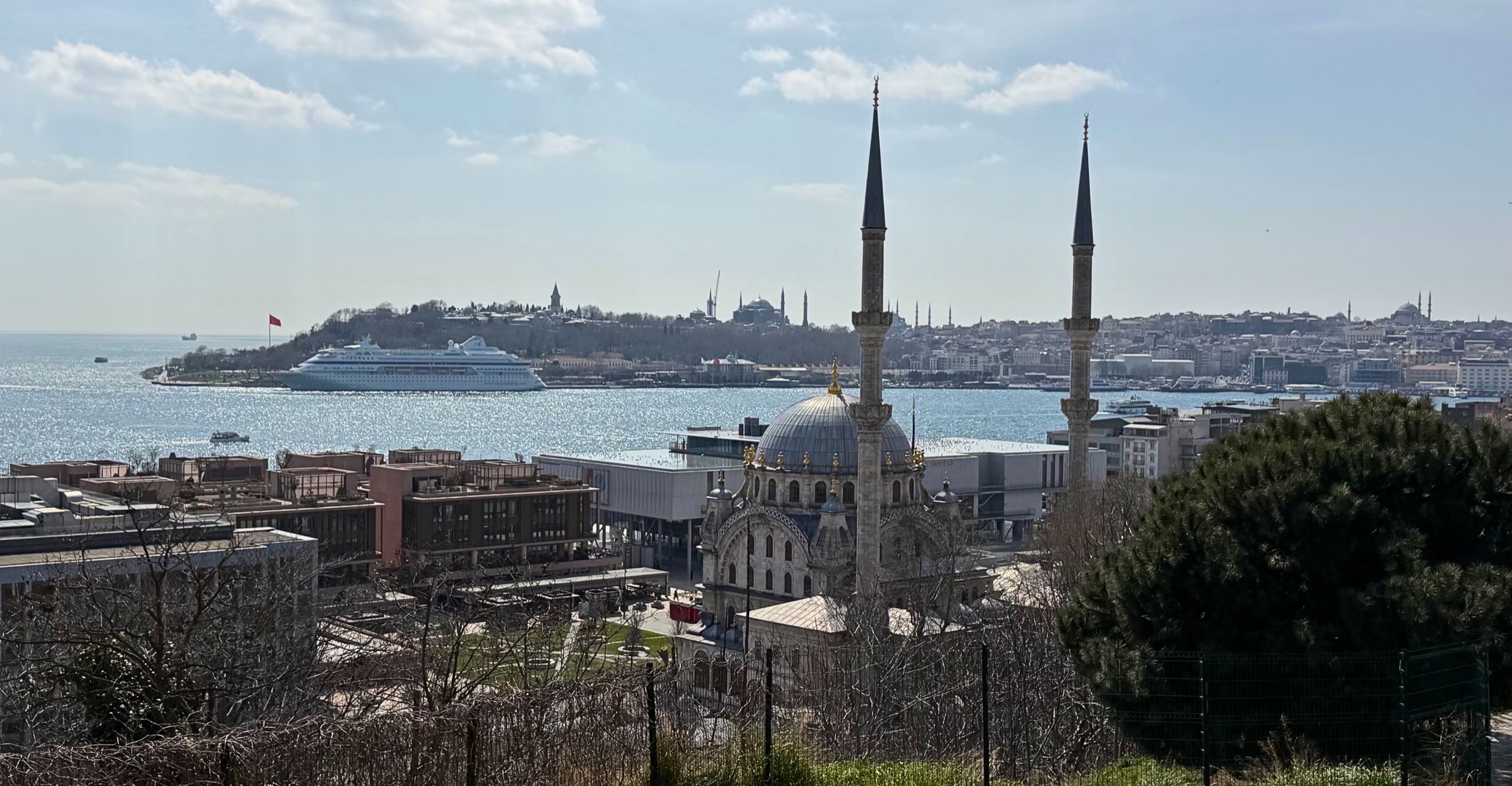 A view of Istanbul with water, rooftops, and the city stretching toward the horizon.