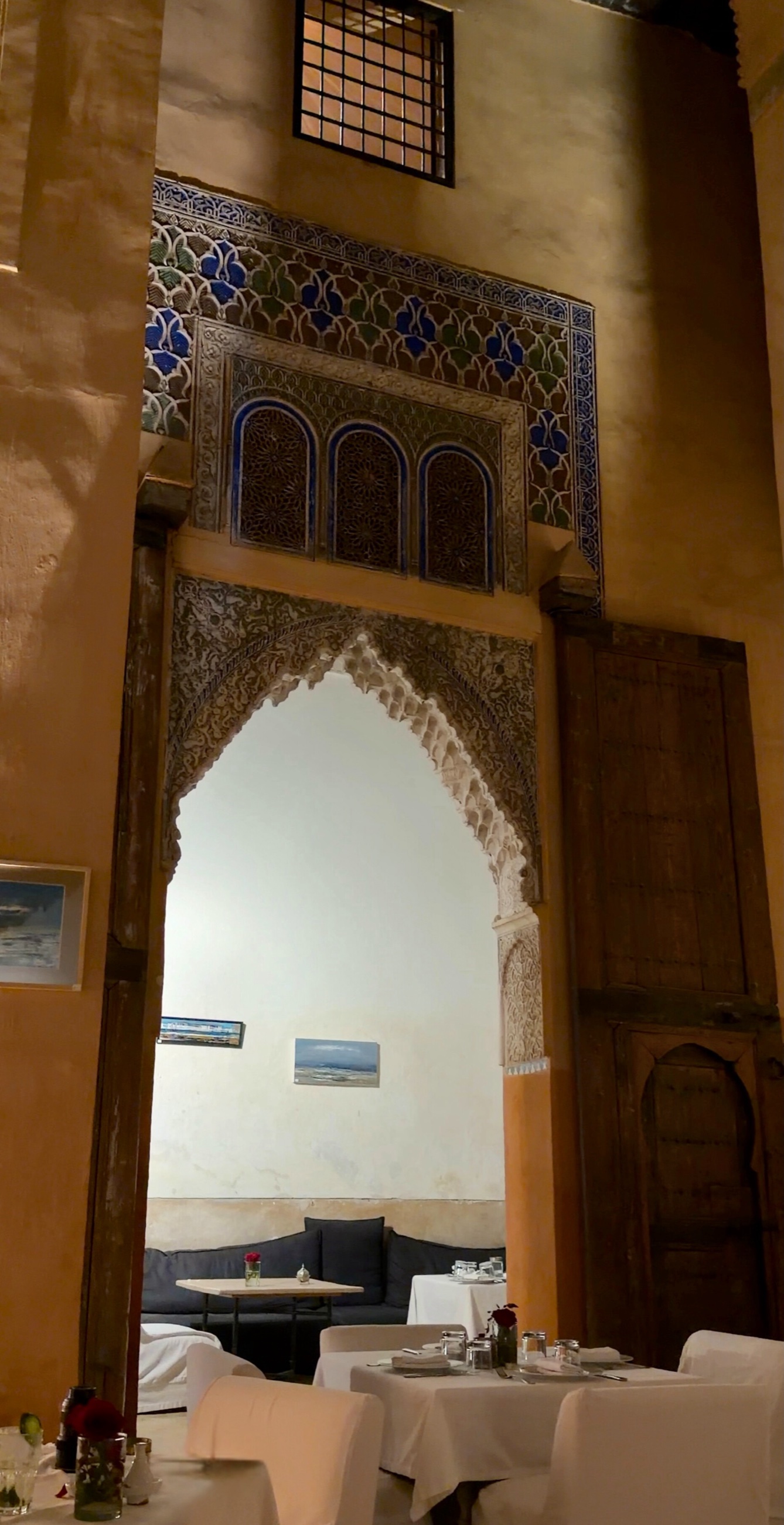 A Moroccan dinner table at Dar Cherifa in a historic riad in the Marrakesh medina.