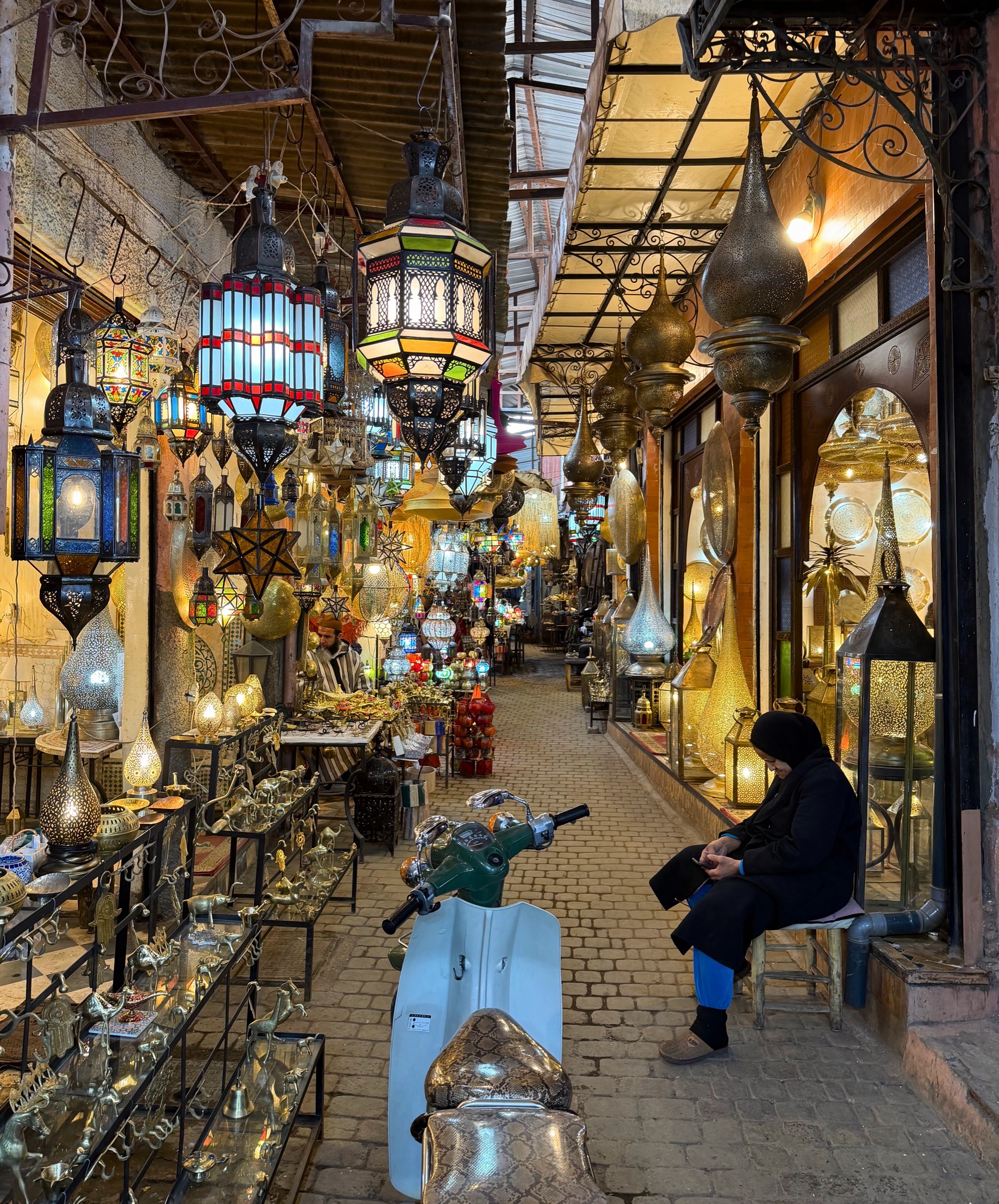 A market stall in the Marrakesh souks with goods displayed for sale.