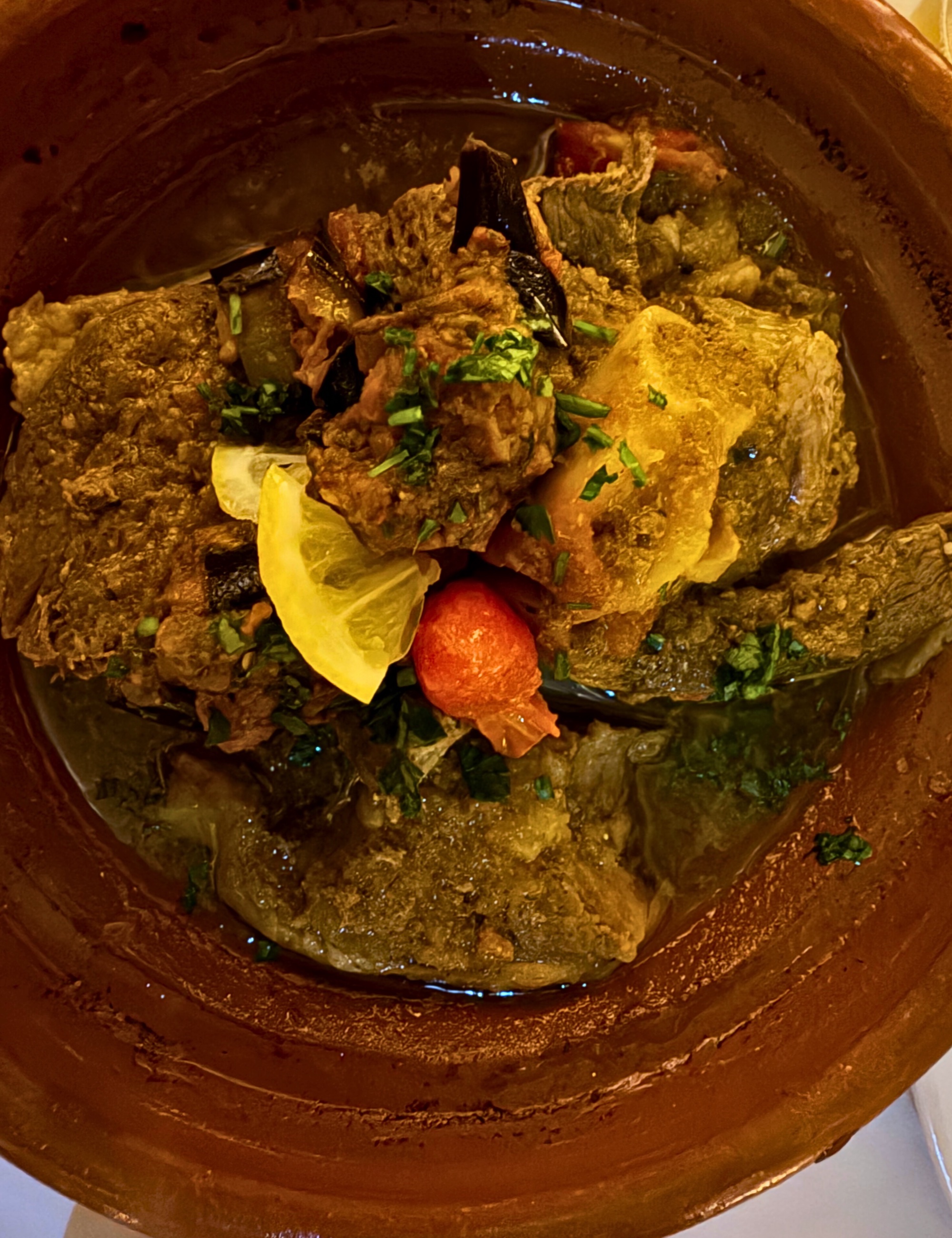 A lamb tagine served in a Moroccan dish.