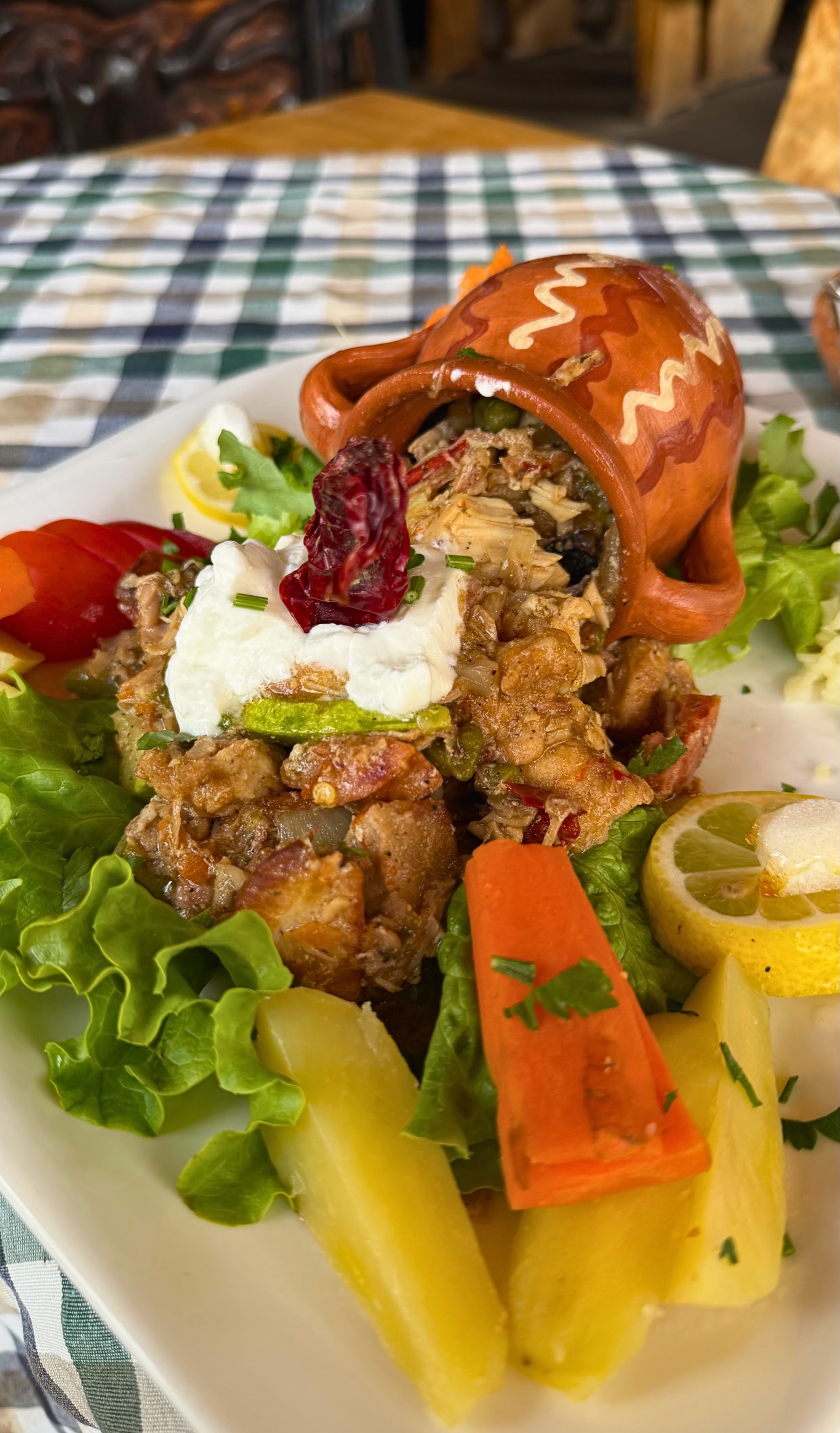 Traditional Macedonian Easter lunch served in a clay pot with vegetables.