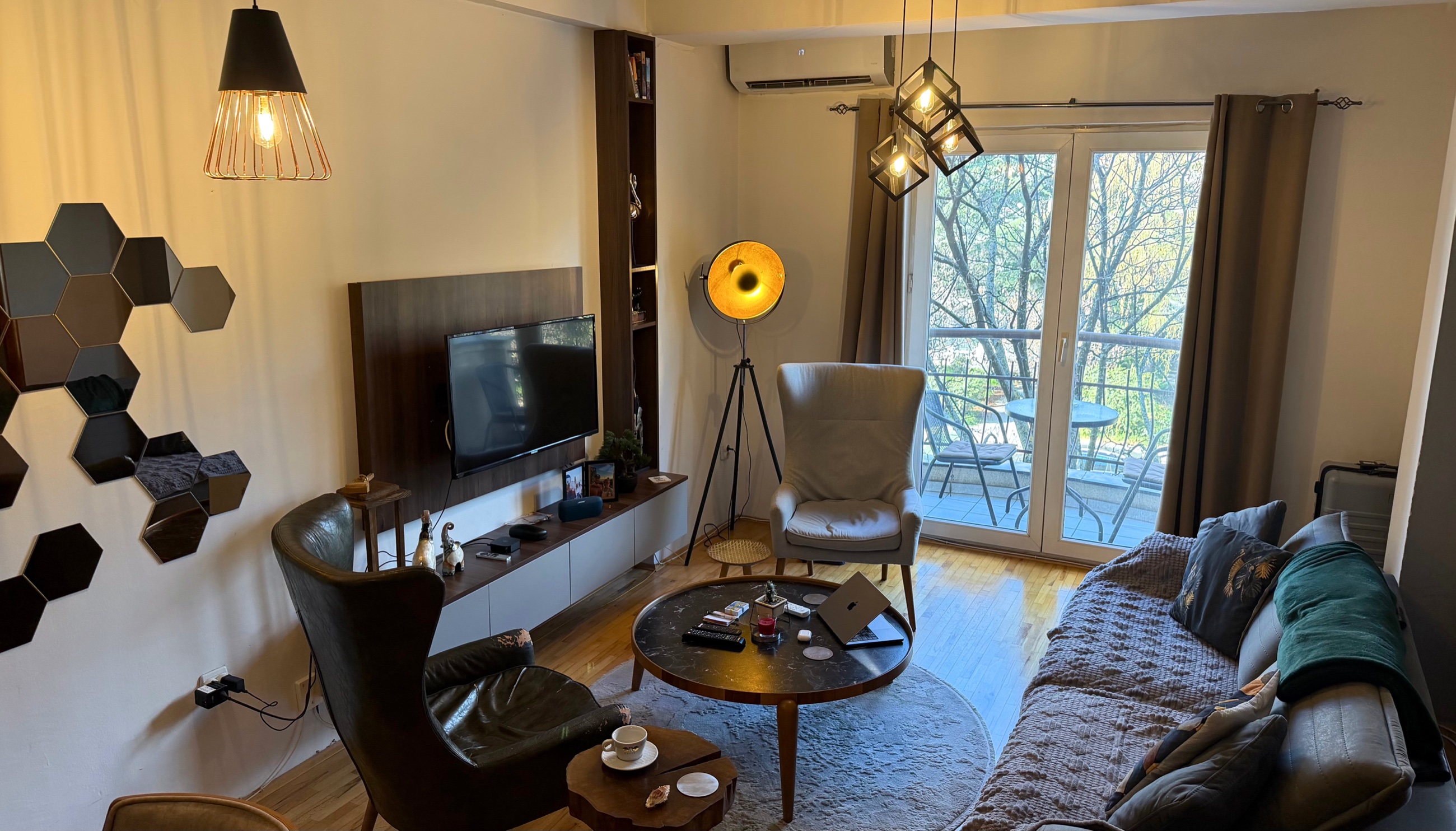 Interior of the Ohrid apartment with a comfortable living area and work-friendly setup.
