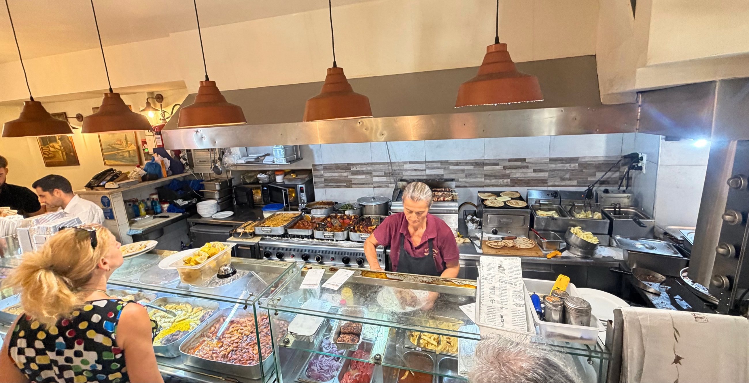 The open kitchen and counter at Nino's Taverna in Corfu Town.