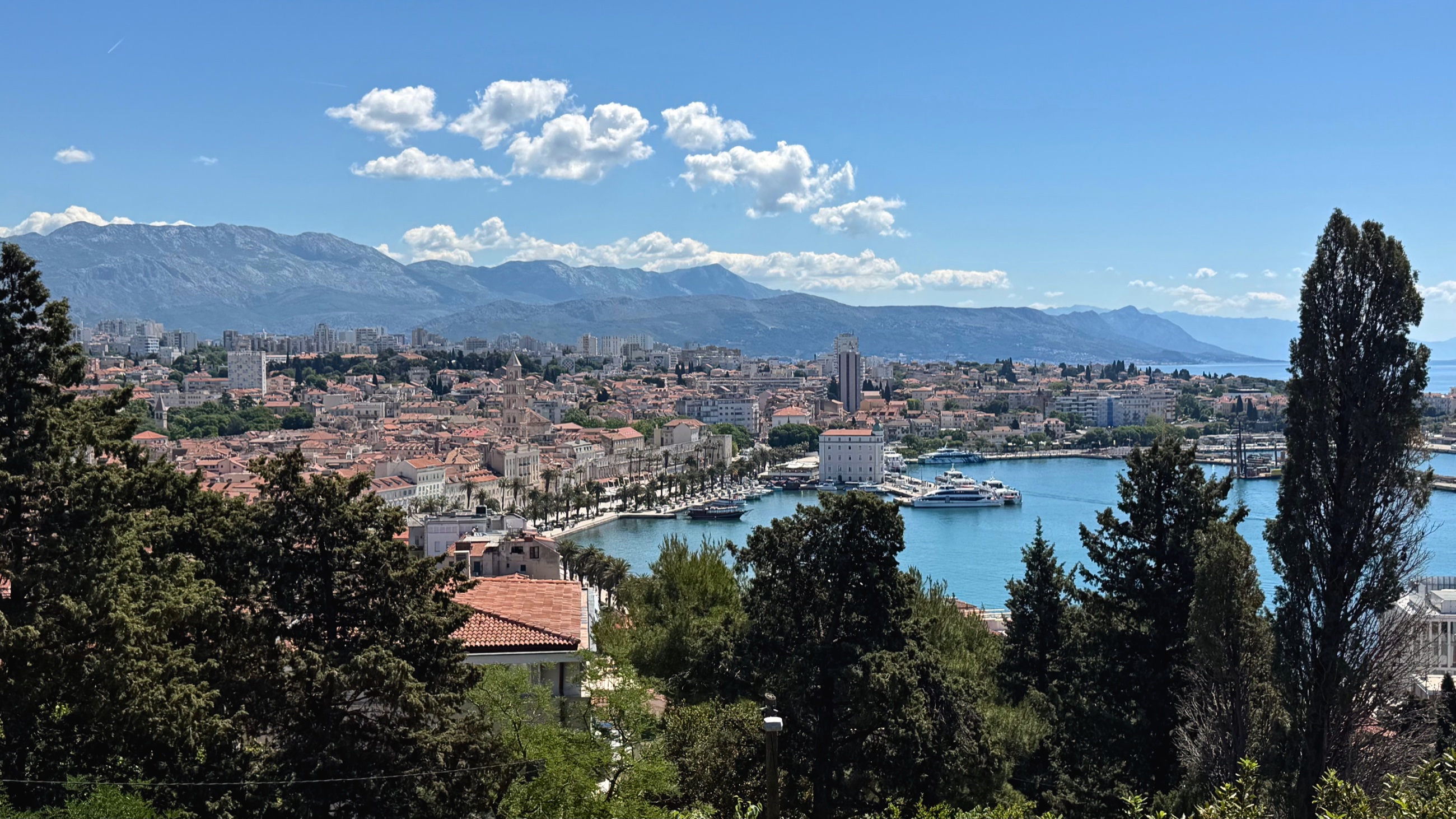 Split from above with the city, port, ferries, and Adriatic coast visible