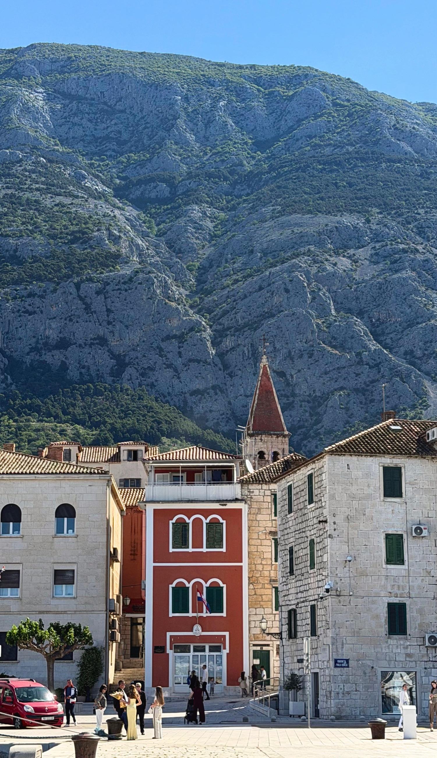 Makarska old town streets pressed below the Biokovo mountain wall