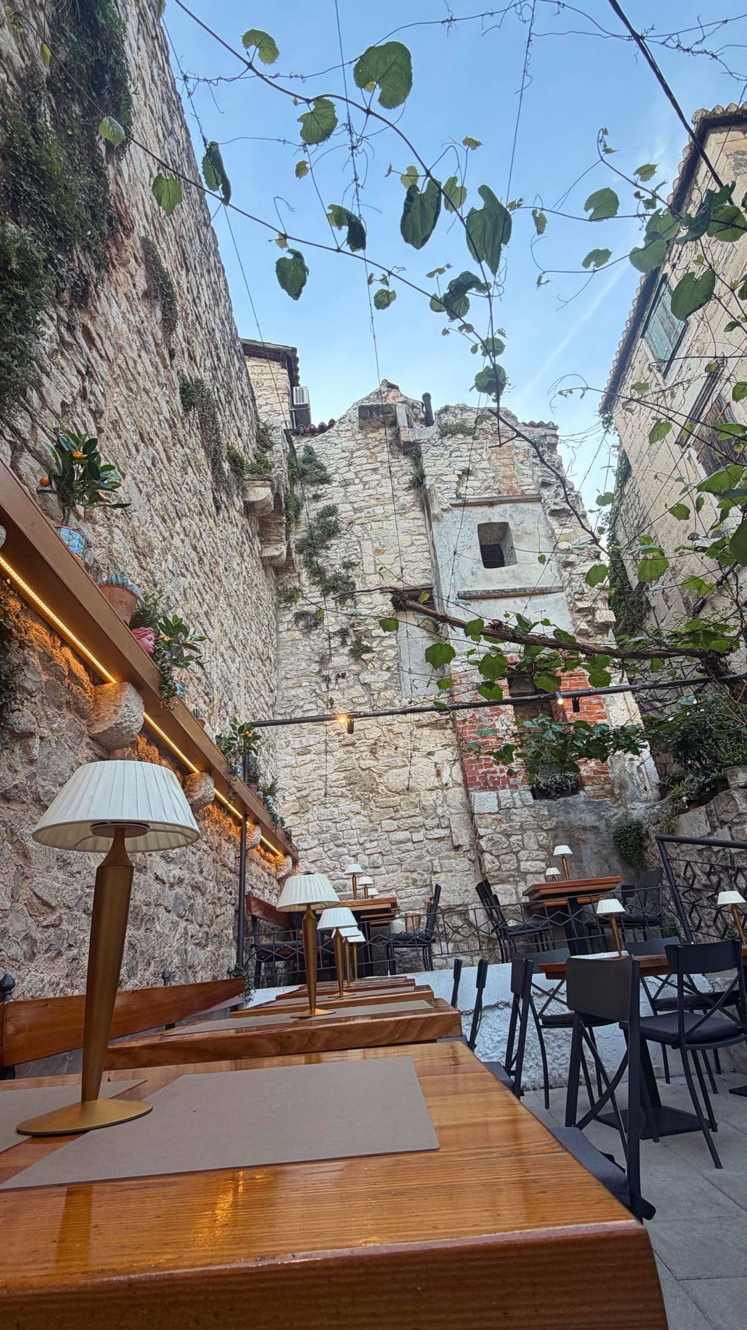 Pizzeria Portas patio inside old stone walls in Split
