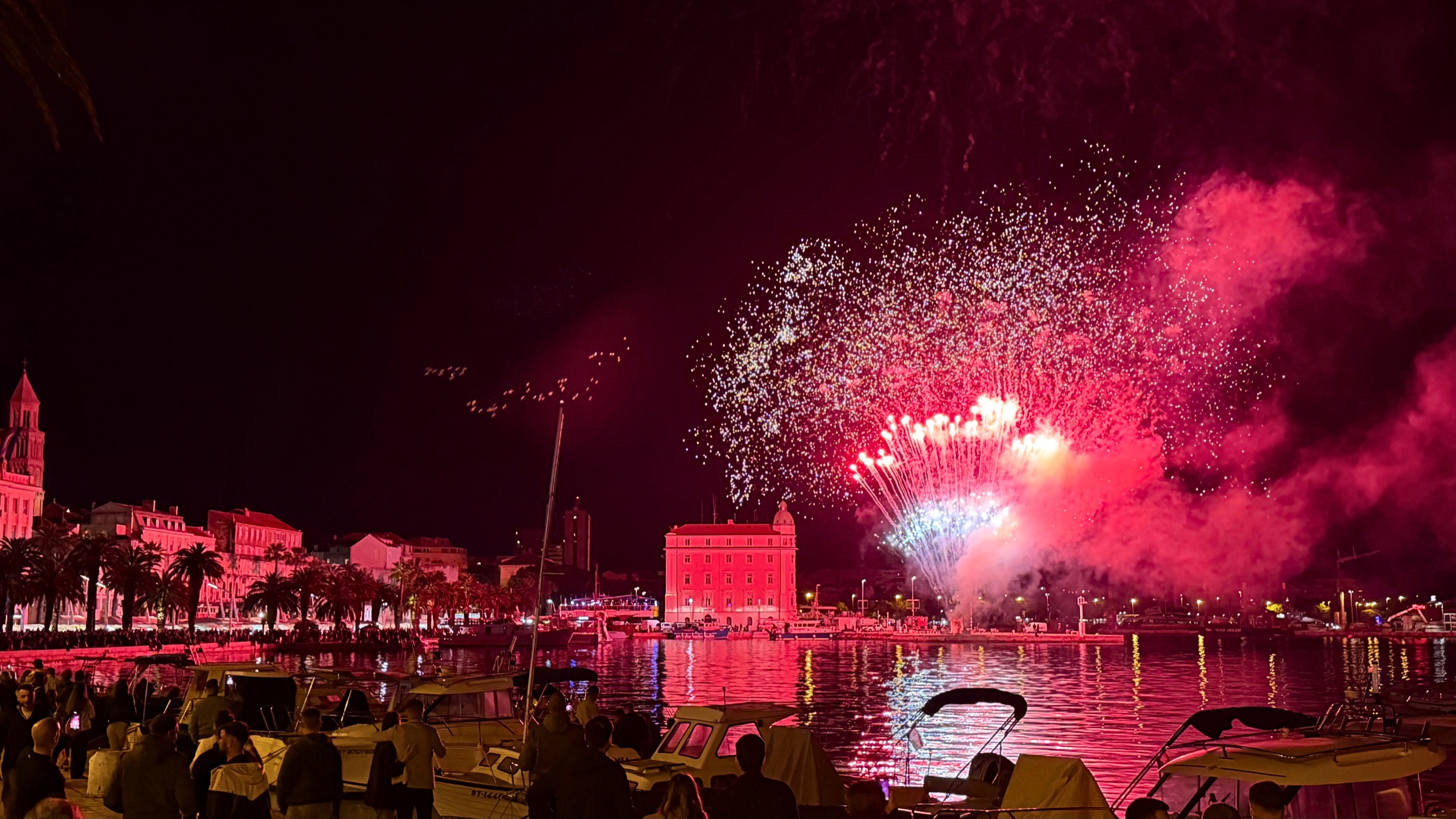 Fireworks over the Split waterfront at night during Sudamja