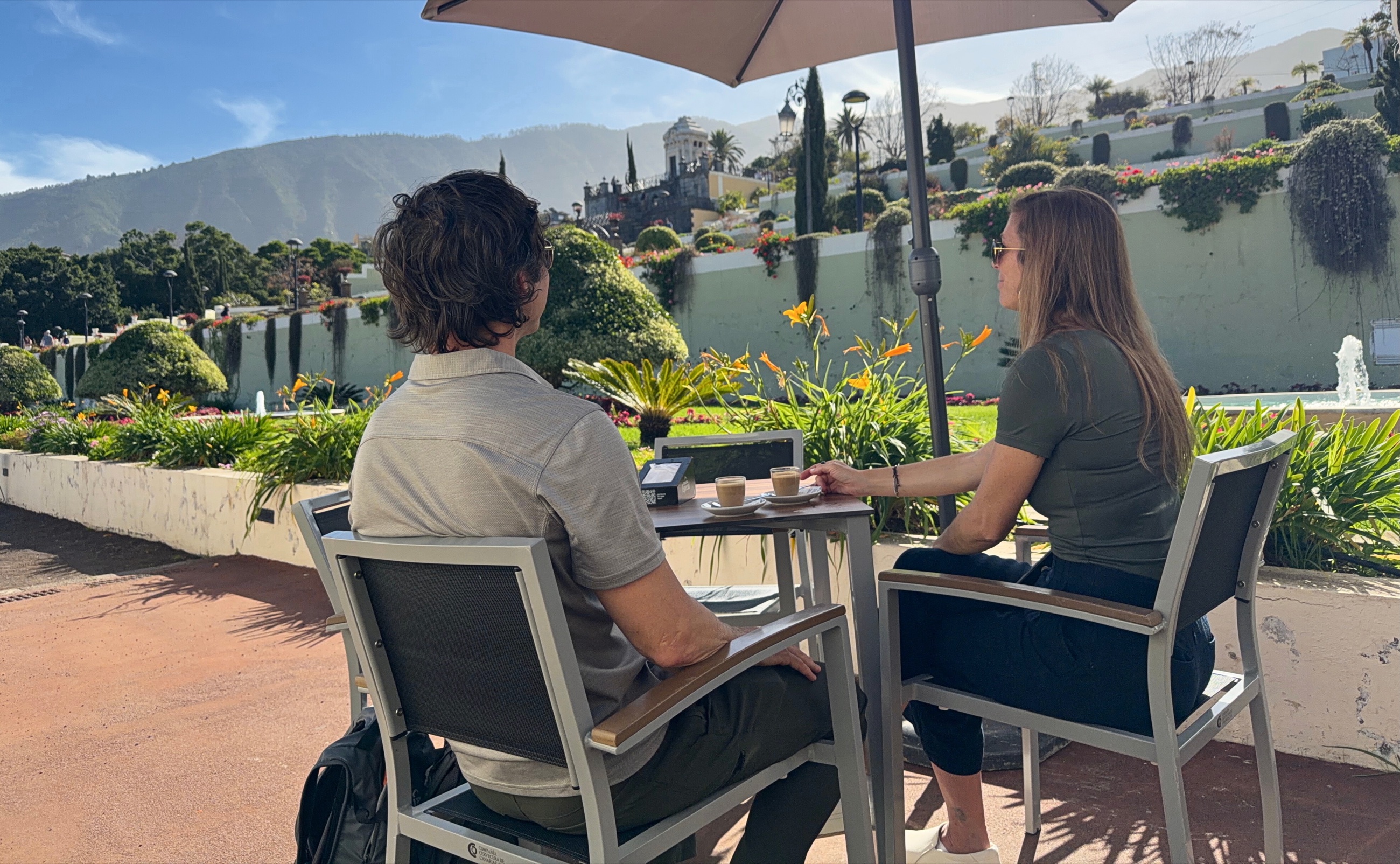 Sam and Stephanie seated with coffee in Victoria Gardens, La Orotava.