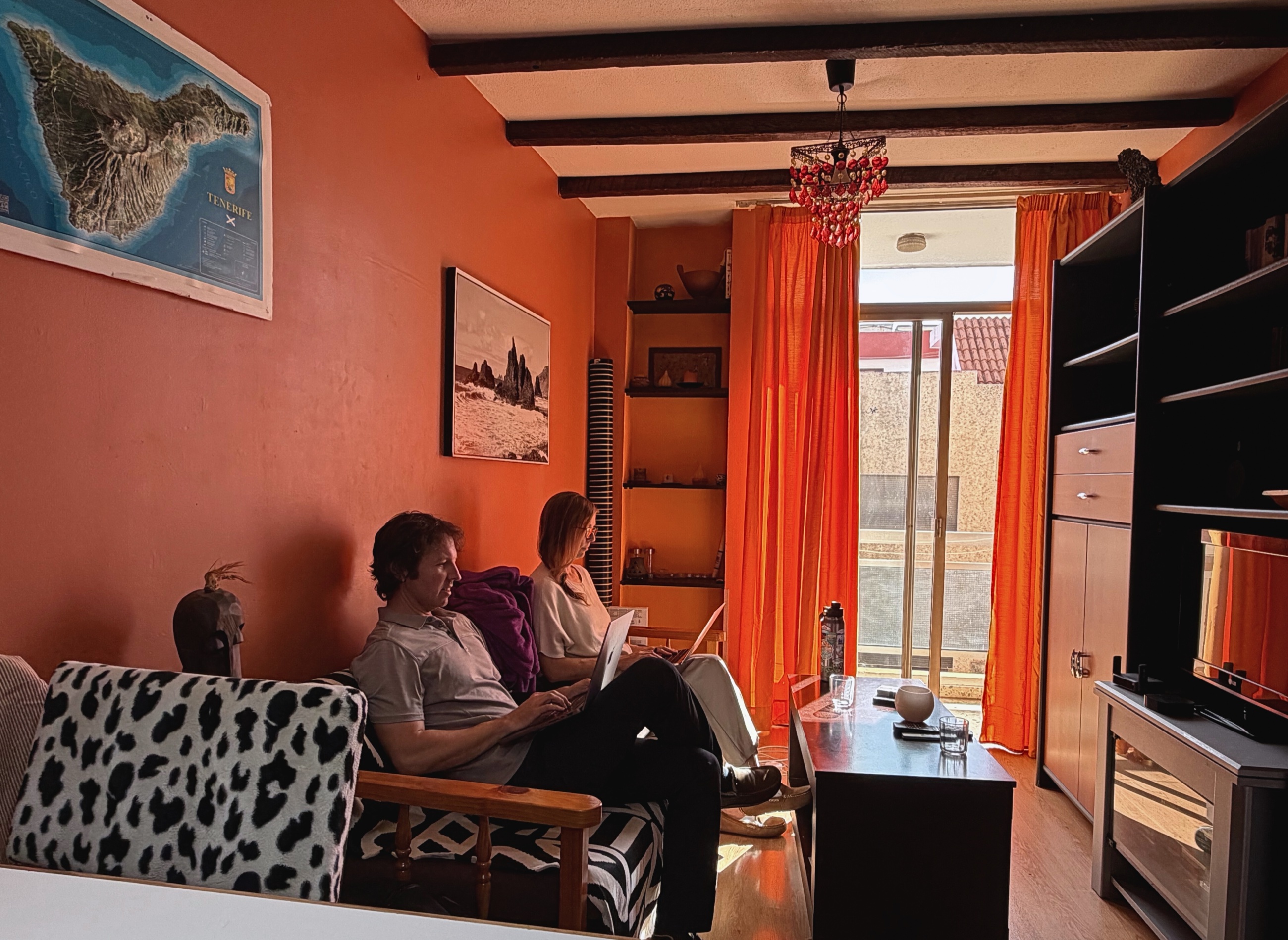 A lived-in apartment table in Tenerife with everyday items.