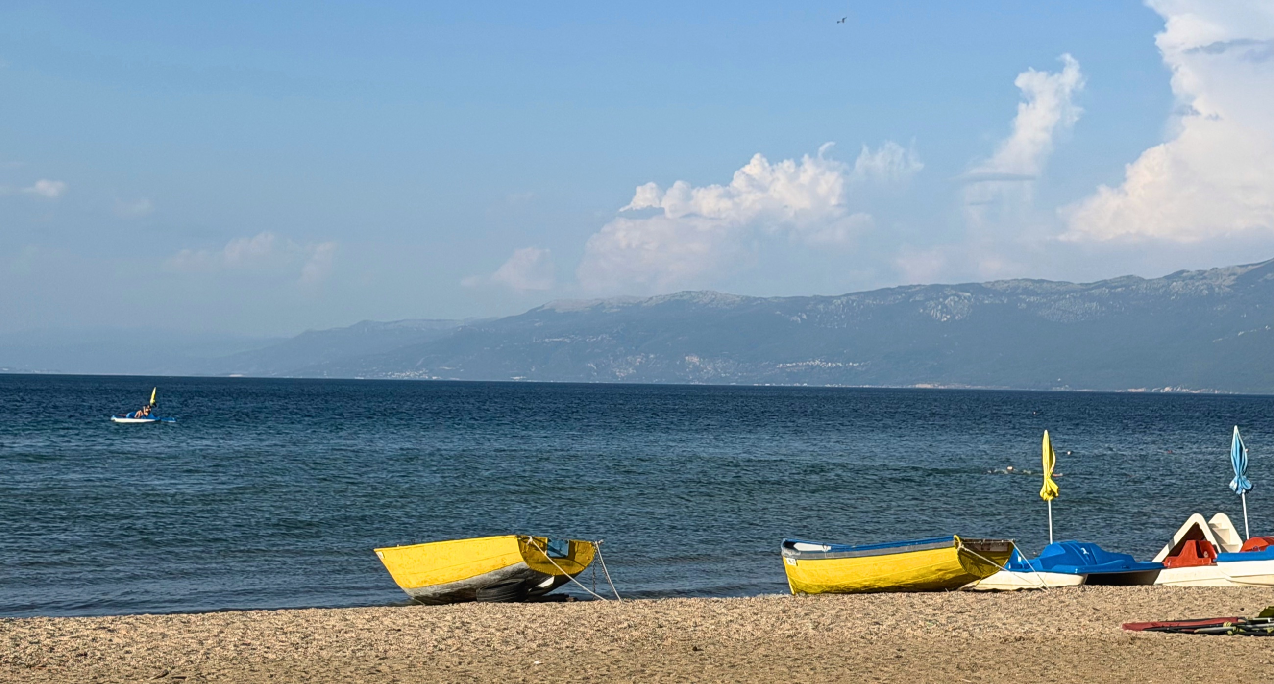 Bright summer boats along the Albanian shore of Lake Ohrid.