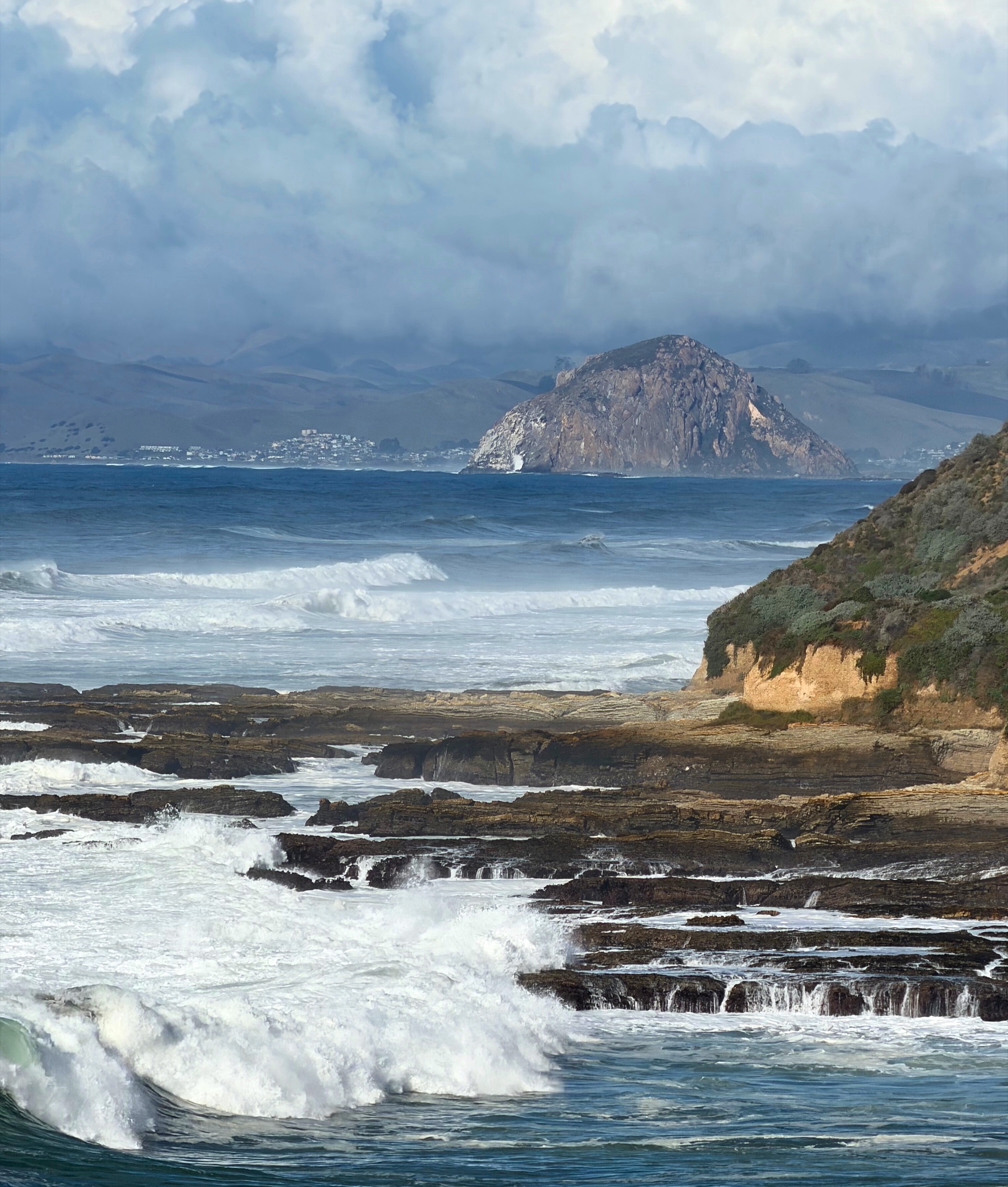 Morro Rock rising over the water near Montaña de Oro